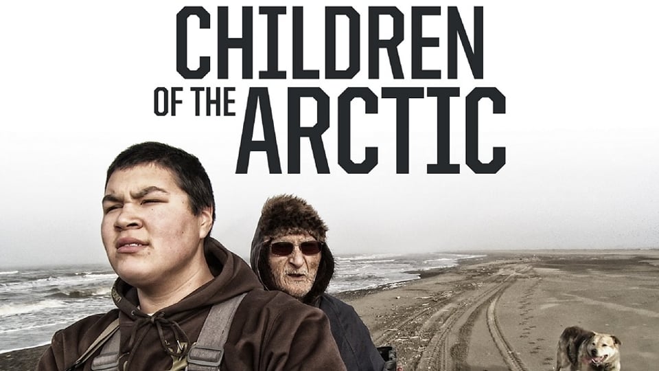 Two individuals and a dog on a beach with the text "Children of the Arctic" above them.
