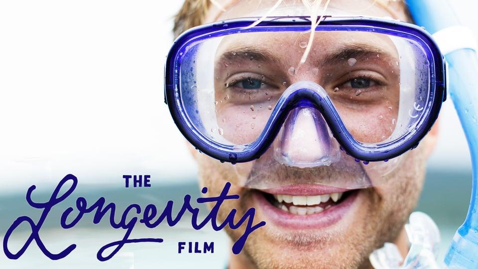 Smiling person wearing snorkeling gear with the text "The Longevity Film" on the image.