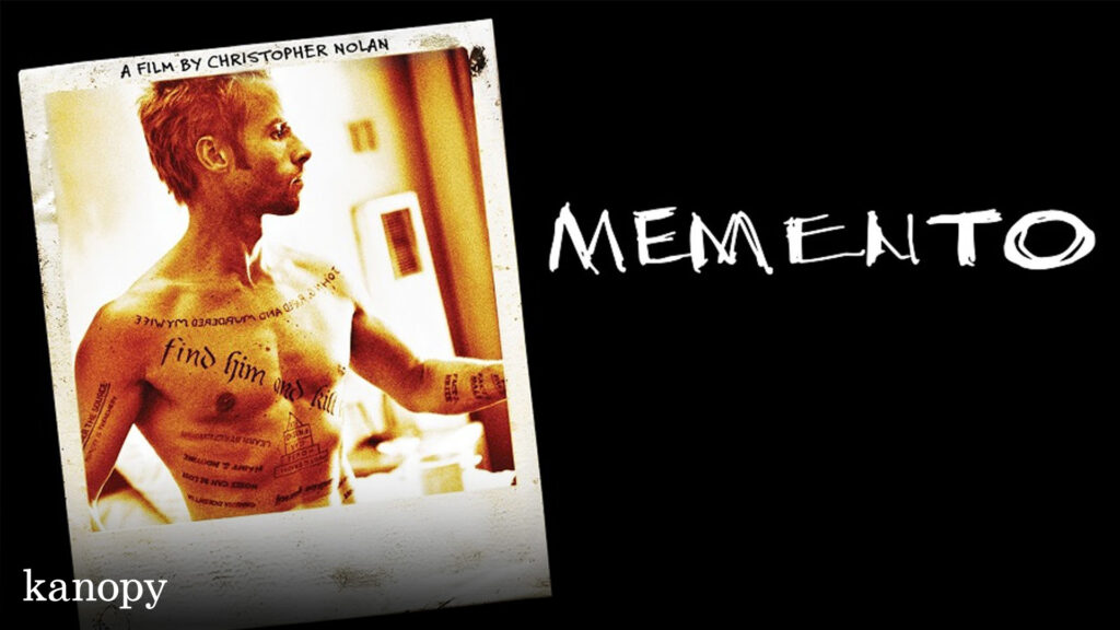 A polaroid of a tattooed man with "Memento" written beside it on a black background.