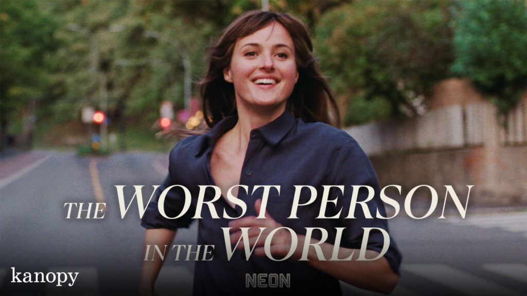 A young woman smiles while running on a city street; text reads "The Worst Person in the World.