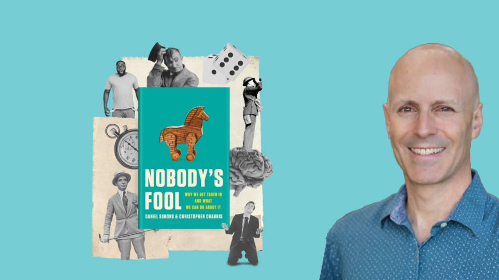 Smiling man next to a book titled “Nobody’s Fool” with various collage elements on a light blue background.