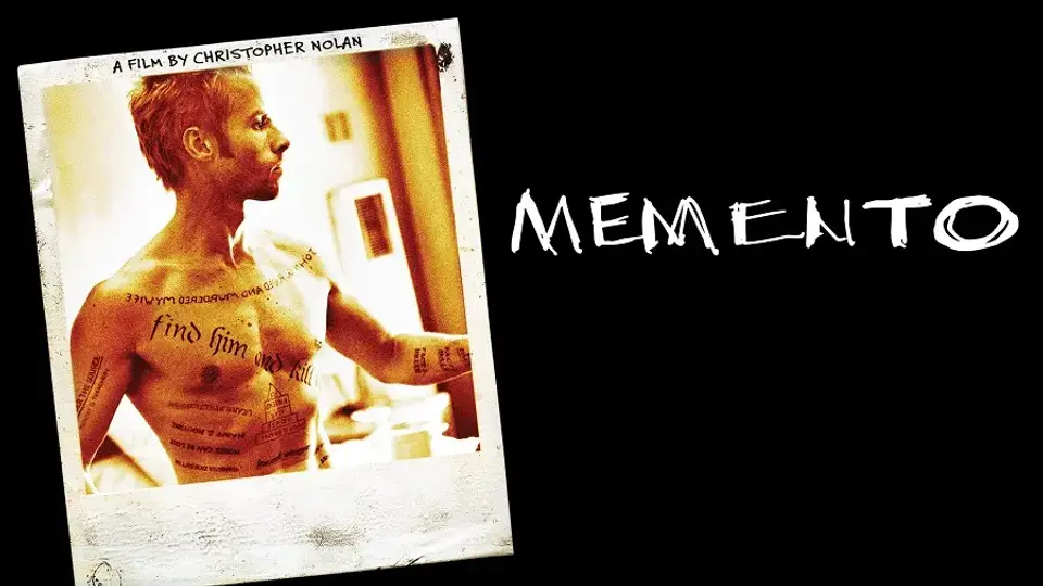 A shirtless man with tattoos stands in a Polaroid photo; "MEMENTO" is written in bold white letters on black.