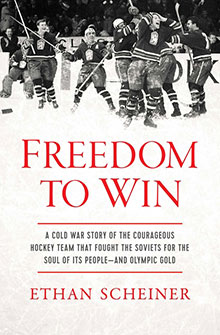 Black and white photo of a hockey team celebrating; book title: "Freedom to Win" by Ethan Scheiner.