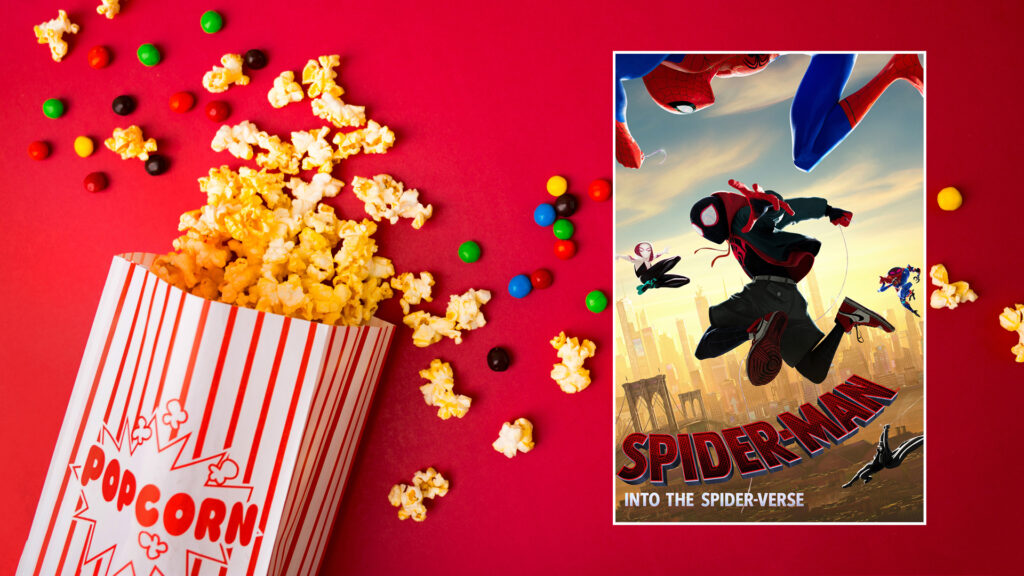 Box of popcorn and colorful candy on red background next to "Spider-Man: Into the Spider-Verse" movie poster.