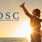 Woman with outstretched arms stands by the ocean at sunset; DuPage ROSC logo and text are visible.