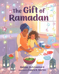 A woman and a child baking together with festive decorations. Text: The Gift of Ramadan.