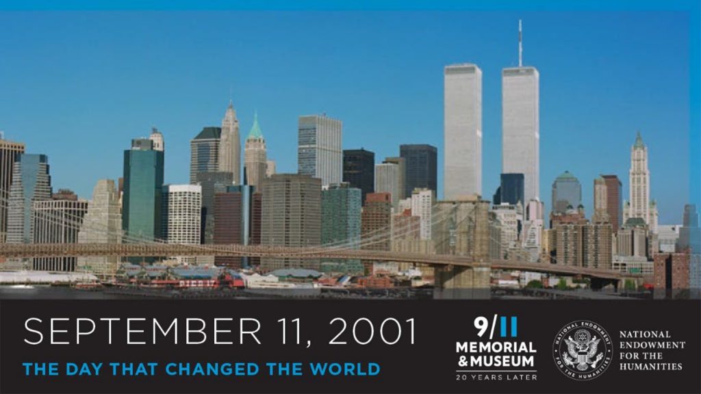 New York City skyline with the World Trade Center towers, text reads "September 11, 2001, The Day That Changed The World.