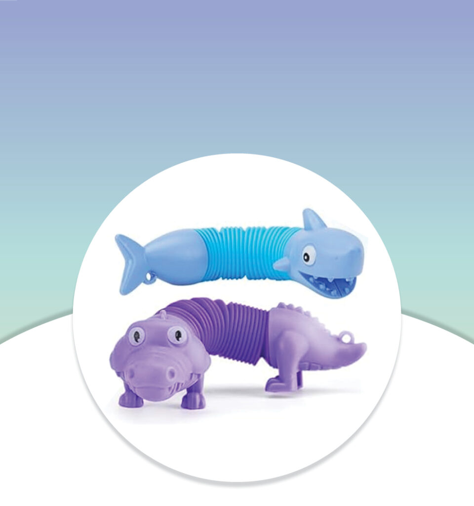 Two animal-shaped blue and purple bendy toys, one a shark and the other an alligator, on a gradient background.