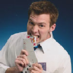 A person in a white shirt biting into a deck of playing cards, set against a blue background.