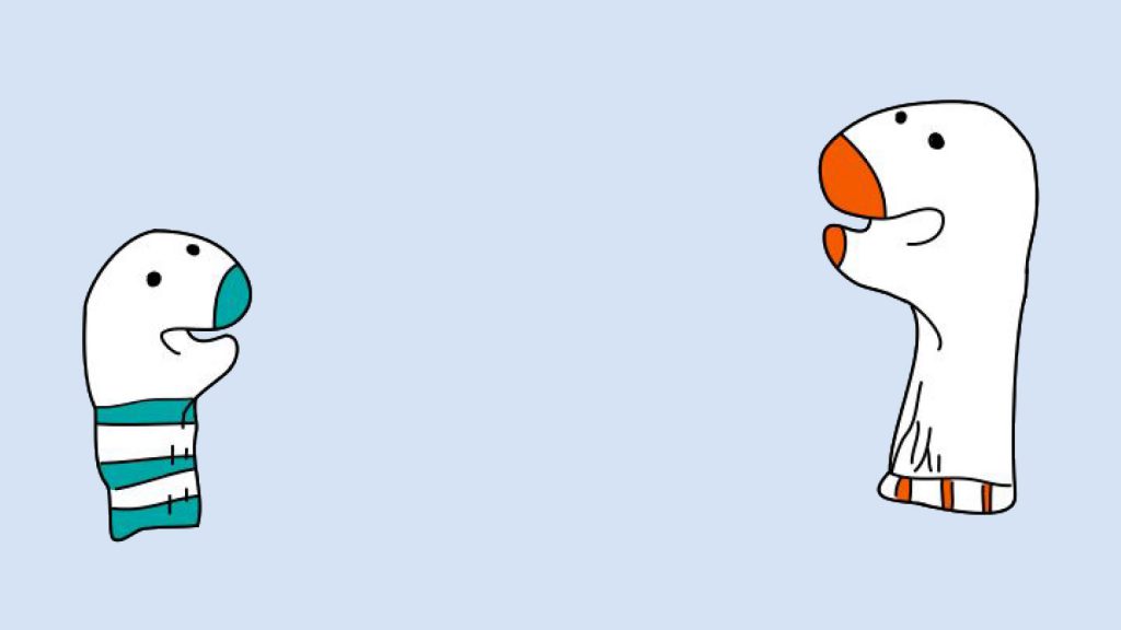 Two cartoon characters facing each other; one is blue and the other is white with orange accents, on a light blue background.