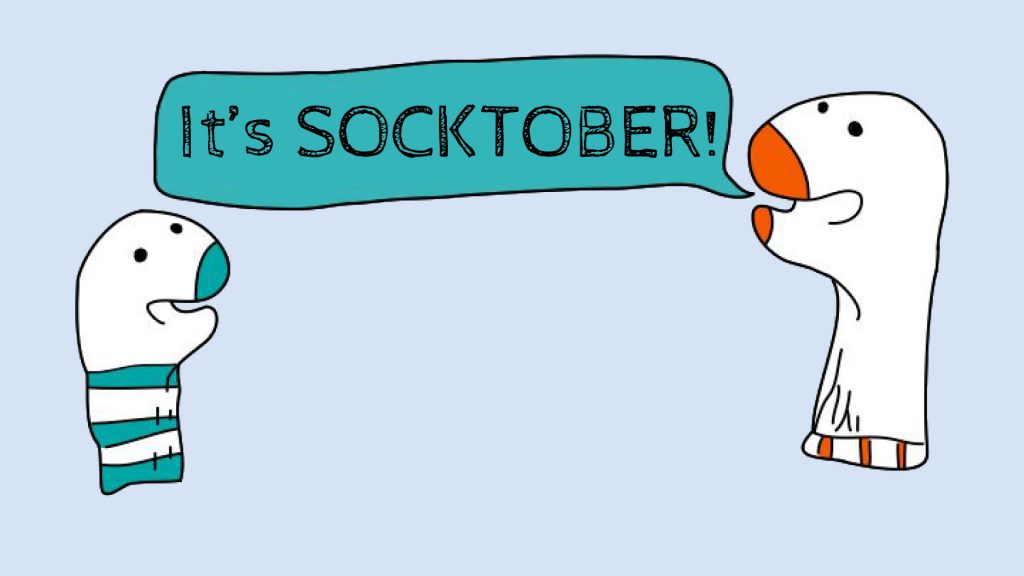 Two cartoon characters; one says "It's SOCKTOBER!" in a speech bubble.