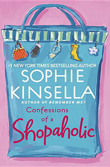 Blue shopping bag with charms, book title "Confessions of a Shopaholic" by Sophie Kinsella on pink background.