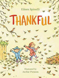 Cover of the book "Thankful" by Eileen Spinelli, illustrated by Archie Preston. Kids play in swirling autumn leaves.