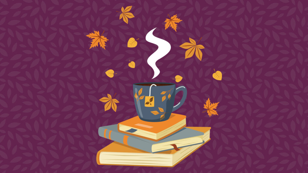 A steaming mug on stacked books with autumn leaves and acorns on a purple leafy background.