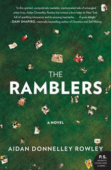 Book cover of "The Ramblers" shows people lying on green grass, seen from above, with scattered blankets and books.