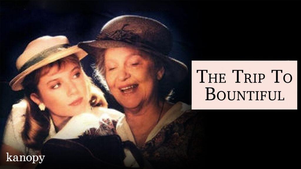 Two women in vintage hats smile warmly beside the title “The Trip to Bountiful” on a dark background.