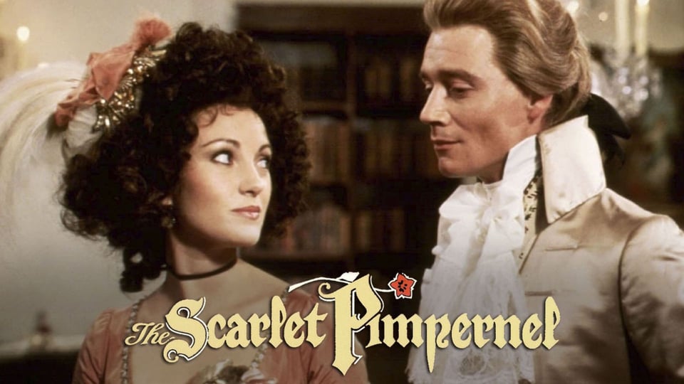 A man and woman in 18th-century attire gaze at each other. Text: "The Scarlet Pimpernel.