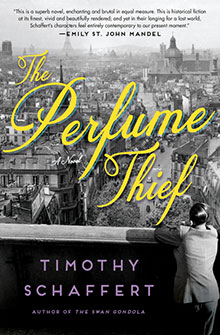 A person in a suit overlooks a cityscape on the cover of "The Perfume Thief" by Timothy Schaffert.