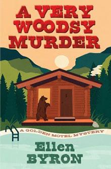 Book cover: "A Very Woodsy Murder" by Ellen Byron. A bear stands by a cabin in a forested mountain setting.