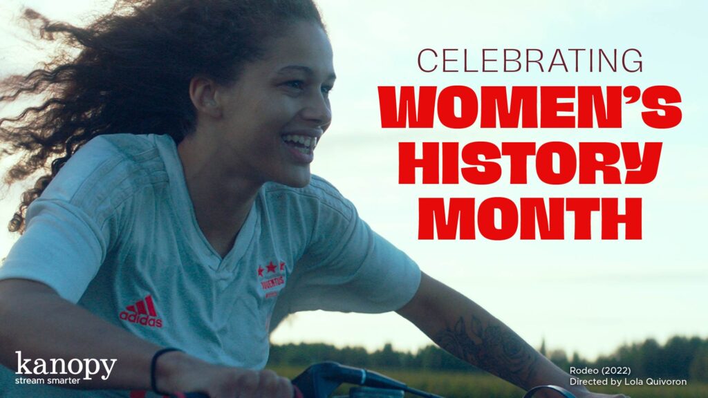 Smiling woman rides a bicycle outdoors. Text: Celebrating Women’s History Month. Kanopy logo in corner.