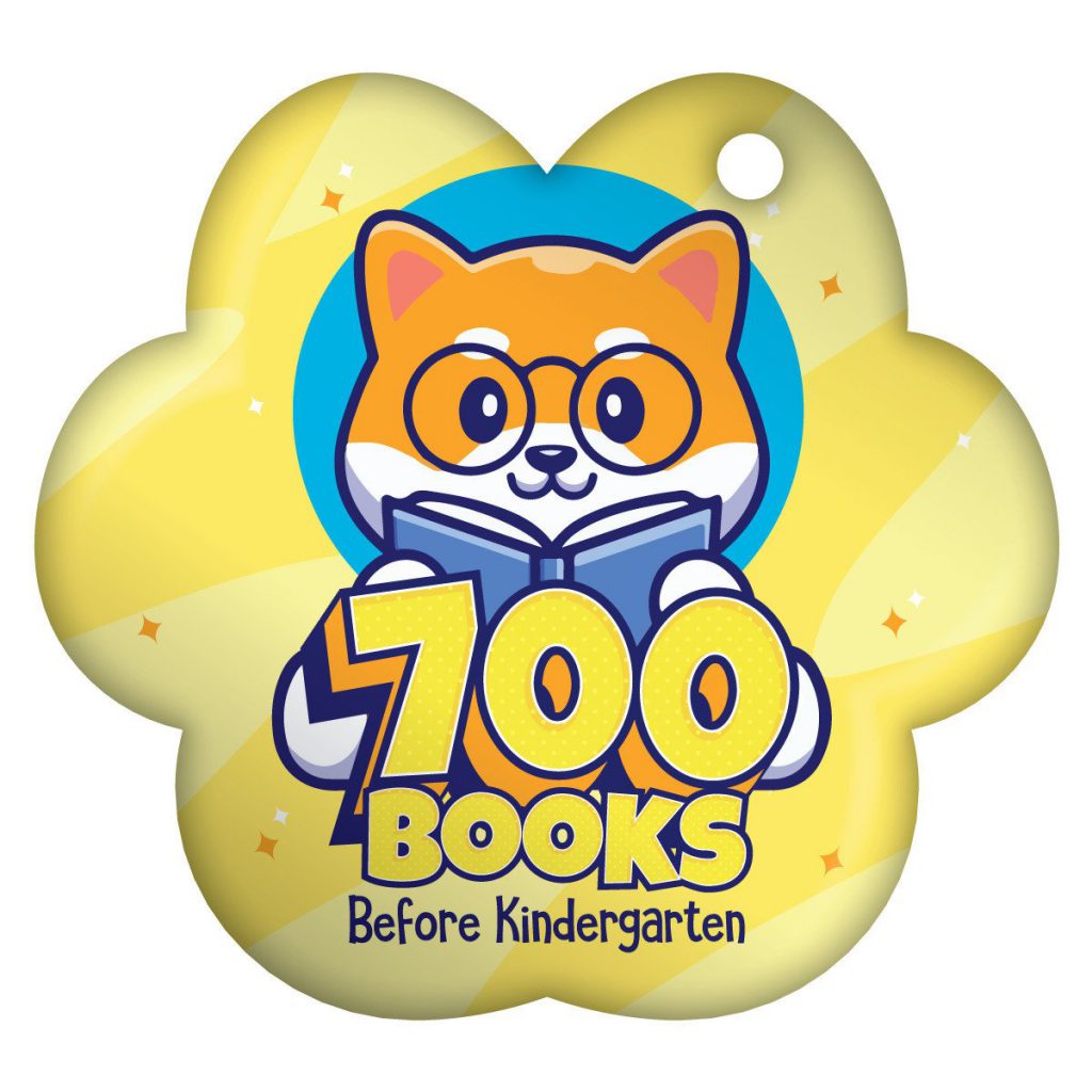 Cute cat with glasses reading a book; text reads "700 Books Before Kindergarten" on a yellow star-shaped background.